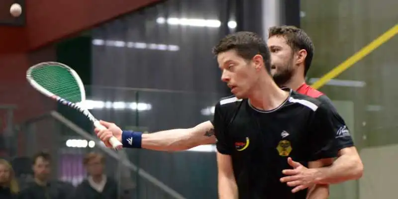 This is a stroke becasue the player behind was not able to hit the ball due to the player at the front. This photo courtesy of Petteri Repo: https://www.instagram.com/rpzil/ Two players getting close to each during a squash match